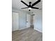 Bedroom with a ceiling fan, closet and access to the en suite bathroom at 811 24Th Street E Ct, Bradenton, FL 34208