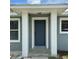 Close-up of the front door framed by white columns and a covered entryway at 811 24Th Street E Ct, Bradenton, FL 34208