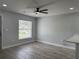 Open-concept living room featuring wood-look floors and modern lighting at 811 24Th Street E Ct, Bradenton, FL 34208