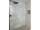 Modern shower with glass enclosure, mosaic tile floor, and marble tile walls at 811 24Th Street E Ct, Bradenton, FL 34208