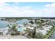 Beautiful aerial view of waterfront property with docks and boat slips near the open bay at 999 Inlet Cir # 103, Venice, FL 34285