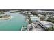Breathtaking aerial view of waterfront community and boat docks along the tranquil shoreline at 999 Inlet Cir # 103, Venice, FL 34285