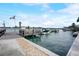 Community boat dock with slips, offering waterfront access and scenic views at 999 Inlet Cir # 103, Venice, FL 34285