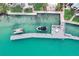 An aerial view of docks and boats on sparkling waters at 999 Inlet Cir # 103, Venice, FL 34285