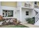 Close up of unit A103 with a well manicured yard and an inviting entrance at 999 Inlet Cir # 103, Venice, FL 34285