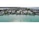Scenic view of waterfront homes with private docks on the shimmering waters with city skyline at 999 Inlet Cir # 103, Venice, FL 34285