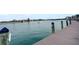 Community waterfront view with a long pier with boat access at 999 Inlet Cir # 103, Venice, FL 34285