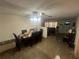 Dining Room with view into living room and kitchen featuring a ceiling fan at 11234 Areca Dr, Port Richey, FL 34668