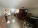 Spacious living room with brick fireplace feature and ample natural light at 11234 Areca Dr, Port Richey, FL 34668