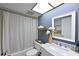 Bright bathroom with a tub and shower combination and a marble topped vanity at 1510 1St W Ave # 102, Bradenton, FL 34205