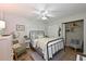 Charming bedroom with a full bed, light walls, and wood-look floors at 1510 1St W Ave # 102, Bradenton, FL 34205