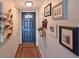 Charming hallway with a decorative front door, stylish decor, and a practical coat closet at 1510 1St W Ave # 102, Bradenton, FL 34205
