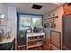 Charming kitchen with custom storage cart, open shelving, and a window view at 1510 1St W Ave # 102, Bradenton, FL 34205