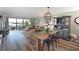 Open concept living space with dining and living area with water views and hardwood floors at 1510 1St W Ave # 102, Bradenton, FL 34205