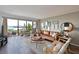Bright living room with water views, comfortable seating, and stylish decor at 1510 1St W Ave # 102, Bradenton, FL 34205