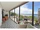 Inviting patio with comfortable seating, lush greenery, and serene water views at 1510 1St W Ave # 102, Bradenton, FL 34205