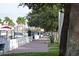 A sidewalk lined with trees and a waterfront at 1510 1St W Ave # 102, Bradenton, FL 34205