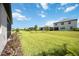 Expansive green backyard offering plenty of room for outdoor activities at 15115 Oxford Grey Dr, Bradenton, FL 34211