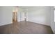 Light-filled bedroom with wood-look tile flooring and neutral paint at 15115 Oxford Grey Dr, Bradenton, FL 34211