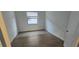 Bright, airy bedroom with wood-look tile flooring and a large window at 15115 Oxford Grey Dr, Bradenton, FL 34211