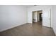 Well-lit room featuring light floors, white walls and doors, and an open doorway at 15115 Oxford Grey Dr, Bradenton, FL 34211