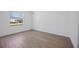 Bedroom featuring wood-look tile flooring and a bright window at 15115 Oxford Grey Dr, Bradenton, FL 34211