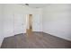 Bedroom featuring wood-look floors and a doorway at 15115 Oxford Grey Dr, Bradenton, FL 34211