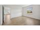 Cozy bedroom with wood-look tile flooring and view to the yard at 15115 Oxford Grey Dr, Bradenton, FL 34211