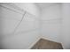 Walk-in closet features ample shelving and neutral design at 15115 Oxford Grey Dr, Bradenton, FL 34211