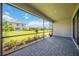 The brick-paved, screened-in lanai provides beautiful backyard views at 15115 Oxford Grey Dr, Bradenton, FL 34211
