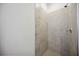 Shower with tile walls and floor, chrome shower head and faucet at 15115 Oxford Grey Dr, Bradenton, FL 34211