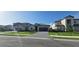 Beautifully landscaped homes with paved driveways create an inviting street view at 15115 Oxford Grey Dr, Bradenton, FL 34211