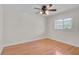 Bedroom featuring hardwood floors, natural light, and ceiling fan at 1674 Cottonwood Trl, Sarasota, FL 34232