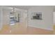 Open living area with dining room access, backyard access, and tile flooring for a modern look at 1674 Cottonwood Trl, Sarasota, FL 34232