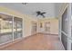 The sunroom features tile floors, recessed lighting, and sliding doors leading to the outdoors at 1674 Cottonwood Trl, Sarasota, FL 34232