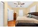 Comfortable bedroom featuring a ceiling fan, neutral colors, and hardwood floors at 1911 26Th W St, Bradenton, FL 34205