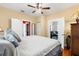 A spacious bedroom with hardwood floors and multiple doors that lead to other rooms at 1911 26Th W St, Bradenton, FL 34205