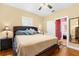 Stylish bedroom with wood floors, neutral colors, and modern lighting fixtures at 1911 26Th W St, Bradenton, FL 34205