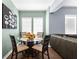 Cozy dining area with a glass table and four chairs, adjacent to the living room, perfect for intimate meals at 1911 26Th W St, Bradenton, FL 34205