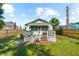 Exterior view of home featuring a wooden deck and a well-maintained lawn at 1911 26Th W St, Bradenton, FL 34205