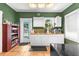 Cozy kitchen featuring white cabinets, wood countertops, modern appliances, and a window at 1911 26Th W St, Bradenton, FL 34205