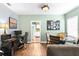 Inviting living space with hardwood floors, an open floorplan, and a view to the kitchen at 1911 26Th W St, Bradenton, FL 34205