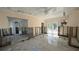 A living room is under renovation, showing exposed studs and flooring at 205 55Th Ave, St Pete Beach, FL 33706