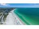 Breathtaking aerial view of beach with sparkling turquoise waters and beautiful coastal scenery at 259 S Polk Dr, Sarasota, FL 34236