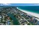 Breathtaking aerial view of the ocean, beach, and neighborhood, offering a glimpse of the beautiful surroundings and coastline at 259 S Polk Dr, Sarasota, FL 34236