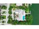 Expansive property with lush landscaping, dock, courtyard, and a sparkling swimming pool at 259 S Polk Dr, Sarasota, FL 34236