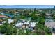 Stunning aerial view of waterfront home with lush landscaping and access to the bay at 259 S Polk Dr, Sarasota, FL 34236