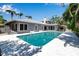 Back exterior view of the house, showcasing the private pool and outdoor living space at 259 S Polk Dr, Sarasota, FL 34236