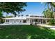 Landscaped backyard with a pool and covered patio offering great outdoor space at 259 S Polk Dr, Sarasota, FL 34236