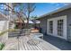 Relaxing backyard deck with outdoor seating area and manicured landscaping at 259 S Polk Dr, Sarasota, FL 34236